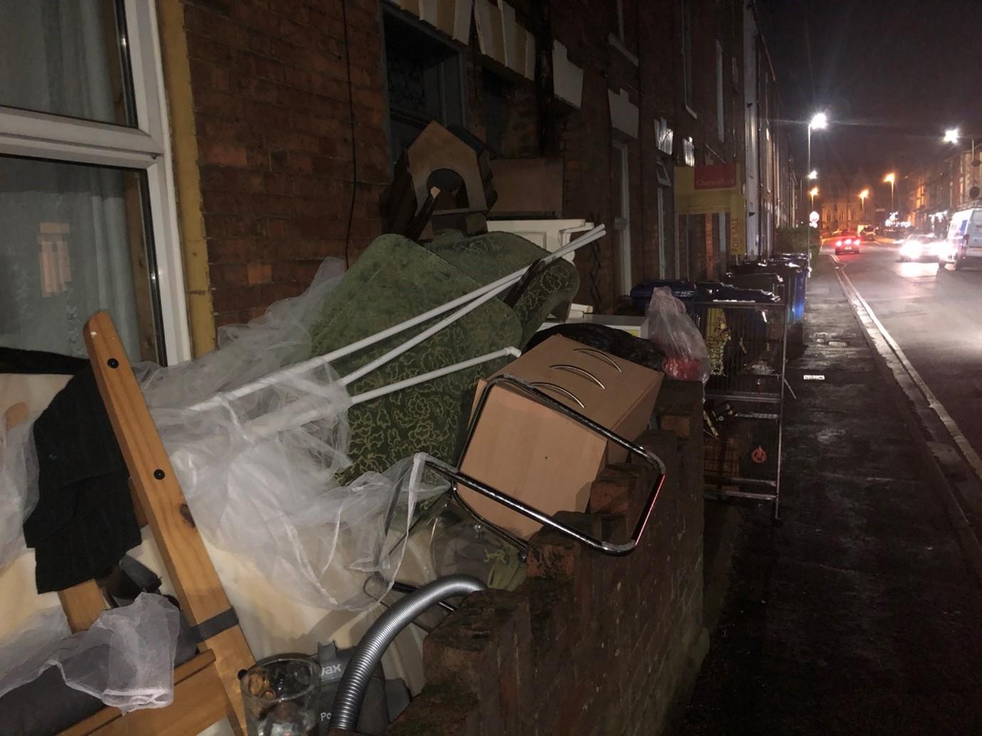 Miss P's belongings piled up in the street in December 2020.