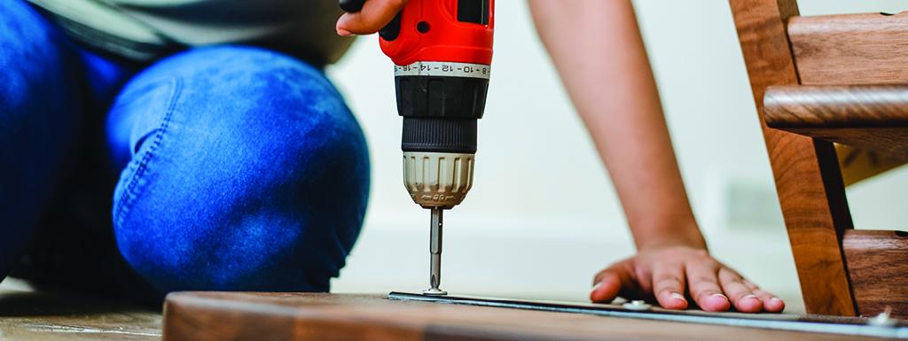 Man using an electric drill
