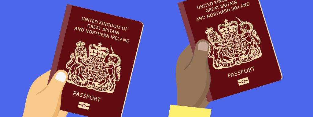 Hands holding two passports