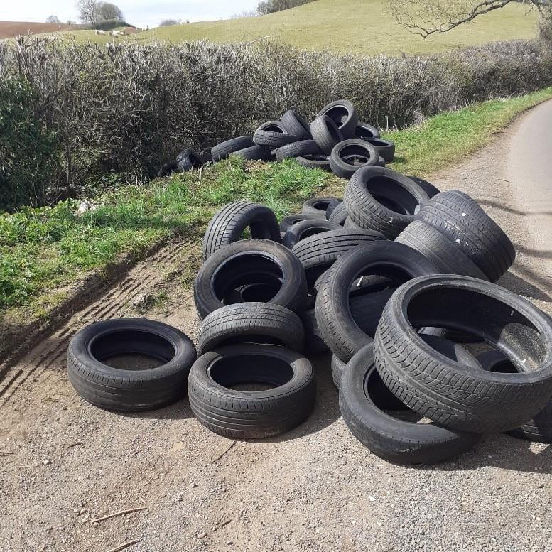 tyres are strewn across a layby