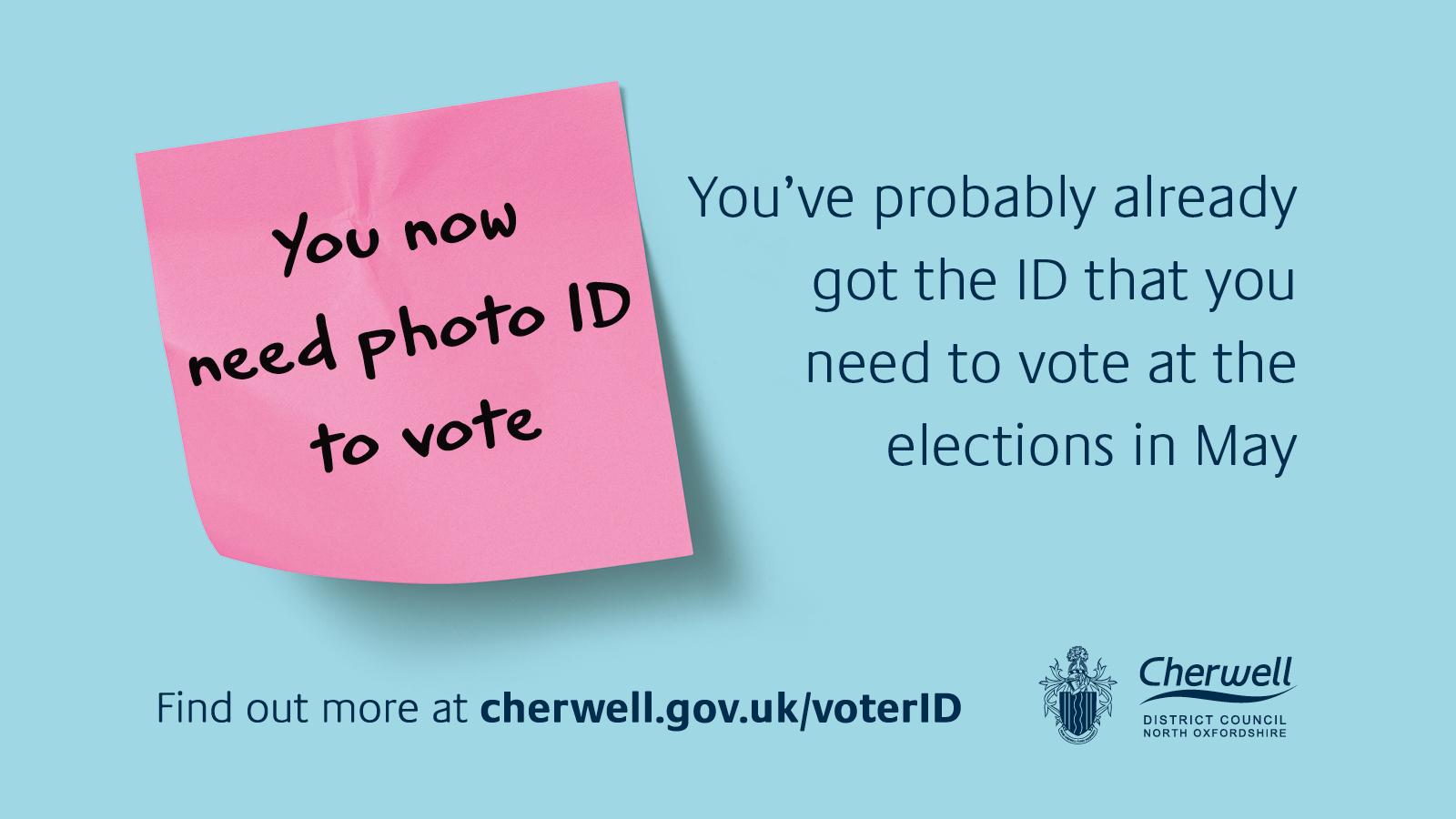 A pink post it note reads you need photo ID to vote