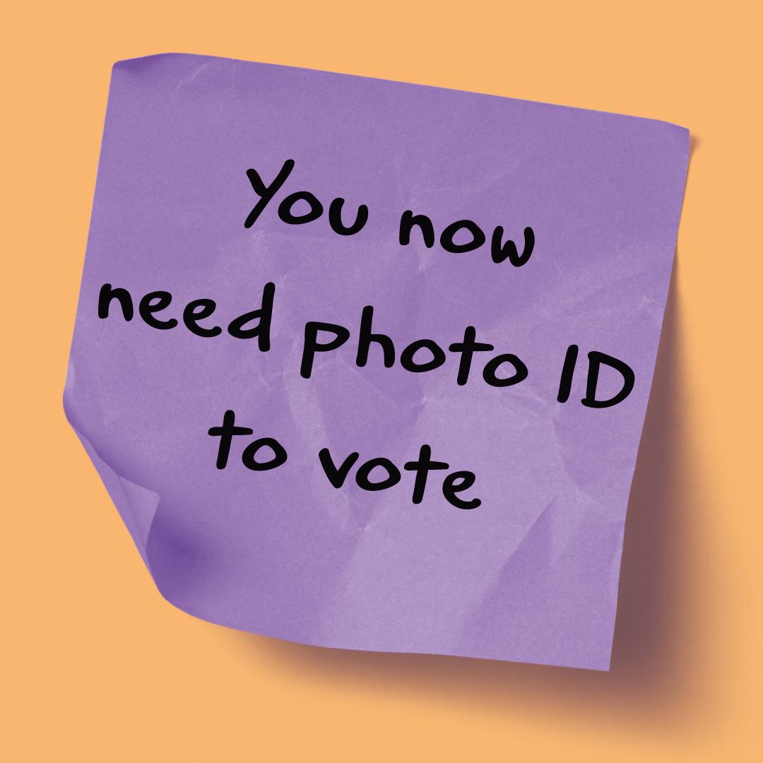 A purple post-it note reads you now need photo ID to vote