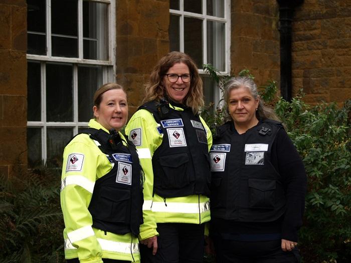 Three community wardens in their uniform