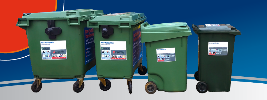 Row of four green general waste bins of various sizes