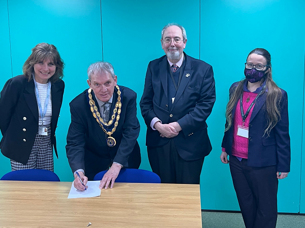 Left to right we see Cllr Rebecca Biegel, Cllr Les Sibley, Cllr Barry Wood and Cllr Katherine Tyson signing the Menopause Workplace Pledge