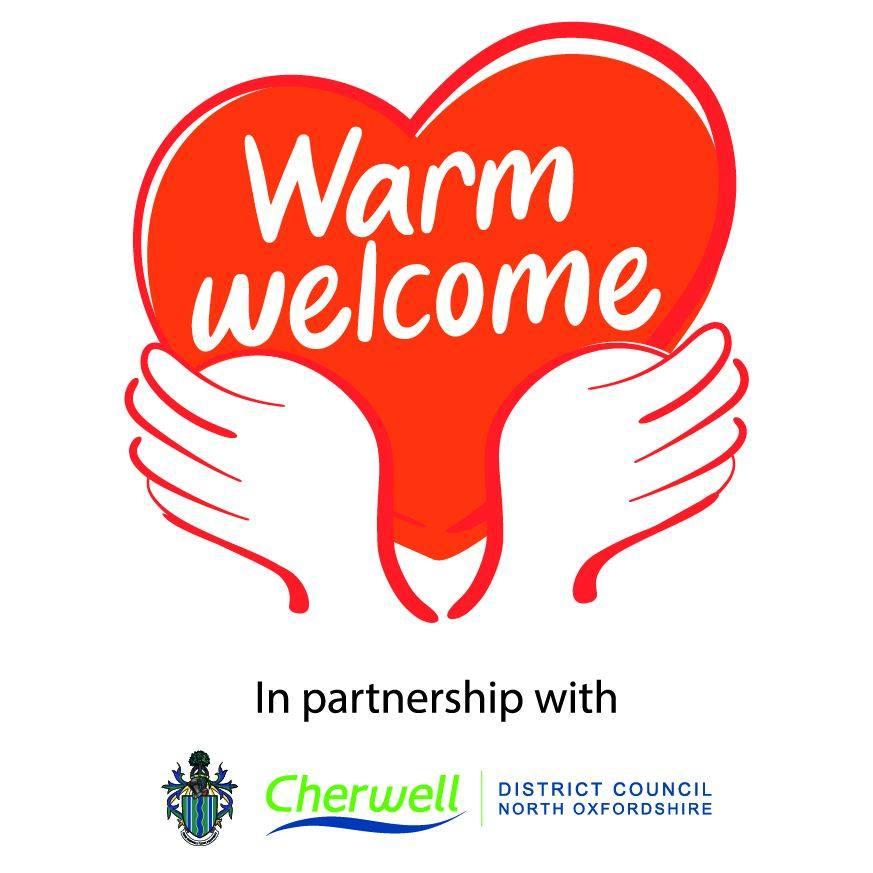 the warm welcome logo shows a pair of hands holding a heart